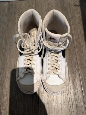 Nike High-Top Sneakers in White with Black Swoosh